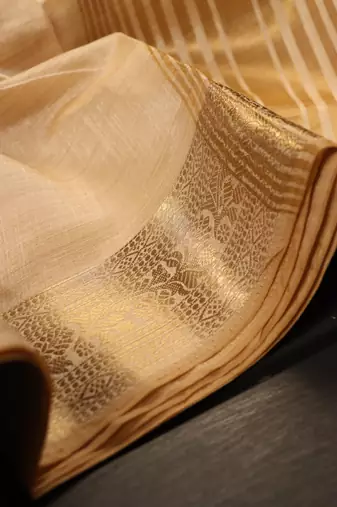 Cream color elegant tussar silk zari weaving saree with unstitched blouse