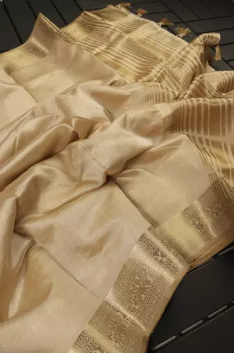 Cream color elegant tussar silk zari weaving saree with unstitched blouse
