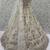 Charming Cream Embroidered Net Engagement Wear Lehenga Choli