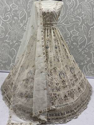 Charming Cream Embroidered Net Engagement Wear Lehenga Choli 6