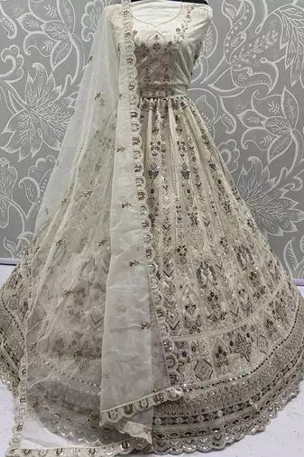 Charming Cream Embroidered Net Engagement Wear Lehenga Choli