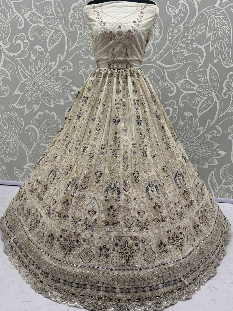 Charming Cream Embroidered Net Engagement Wear Lehenga Choli