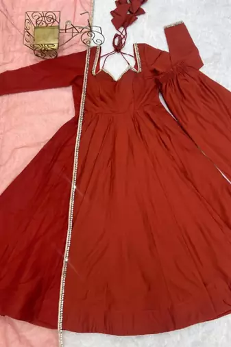 Rust color roman silk chanderi solid -mirror lace work anarkali set full stitched.