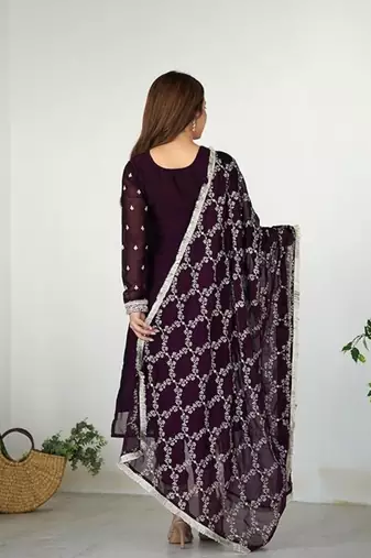 Wine color rangoli silk thread sequince embroidered work anarkali set full stitched.