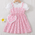 Peach floral print puff sleeve fit & flare girls dress with heart sling bag