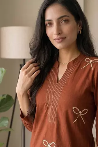 Women new trendy rust orange embroidered cotton kurta with palazzos
