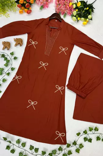 Women new trendy rust orange embroidered cotton kurta with palazzos