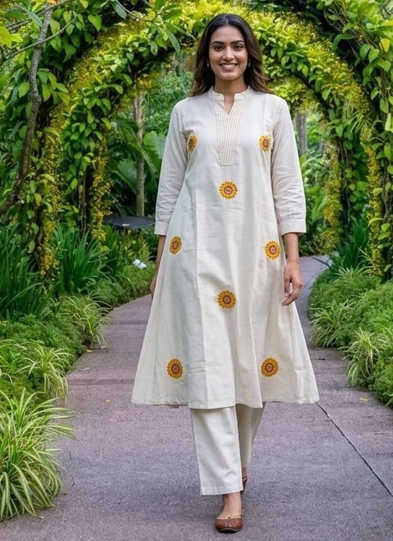 New latest women off-white embroidered cotton a-line kurta with trousers