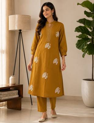 Women mustard cotton printed kurta with trousers co-ord set 3