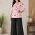 Women white & rani pink bold floral printed cotton kurti with black wide-leg palazzo set