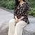 Womens new trendy black floral printed short kurti with beige palazzo set