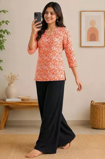 Womens new trendy orange floral printed short kurti with beige palazzo set
