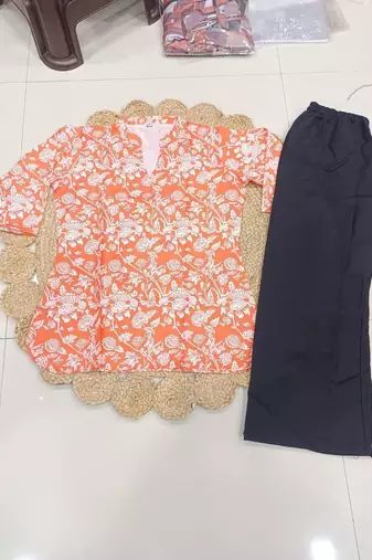 Womens new trendy orange floral printed short kurti with beige palazzo set
