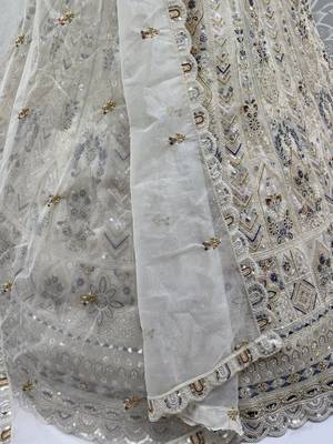 Charming Cream Embroidered Net Engagement Wear Lehenga Choli 8