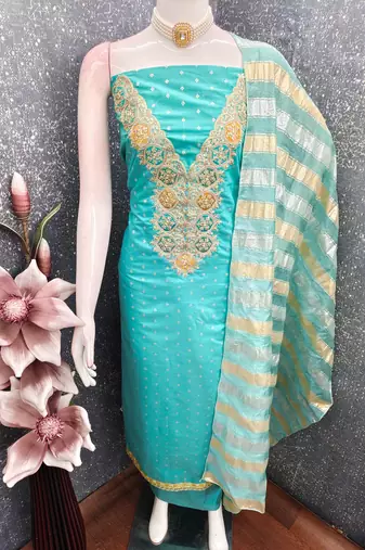 Firozi color modal butti fabric woven and embroidered ethnic suit for girls