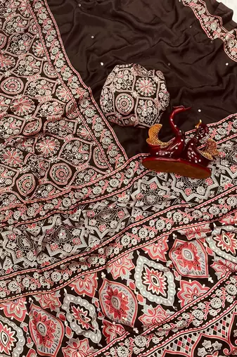 dark brown ajarakh print with mirror and beautiful tussle crepe silk saree