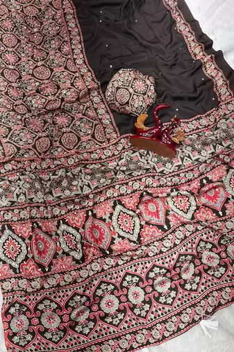 dark brown ajarakh print with mirror and beautiful tussle crepe silk saree