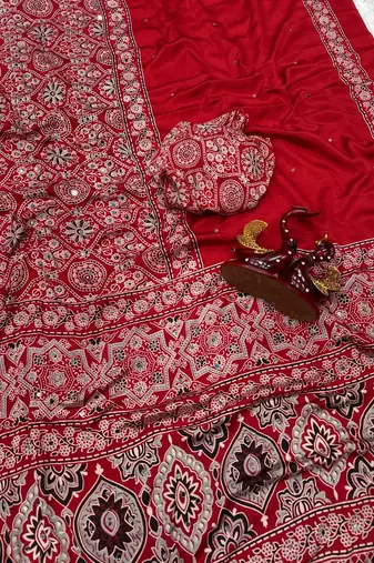 red ajarakh print with mirror and beautiful tussle crepe silk saree