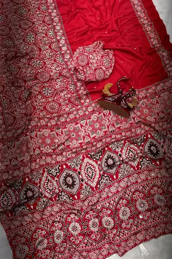 red ajarakh print with mirror and beautiful tussle crepe silk saree