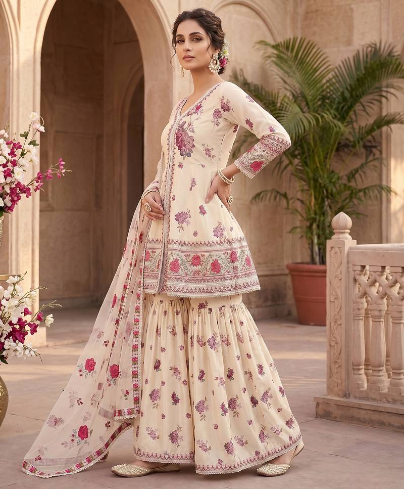 Designer wedding wear cream crepe silk printed embroidery peplum sharara set