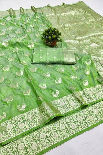 Light green zari woven banarasi silk blend saree with blouse piece