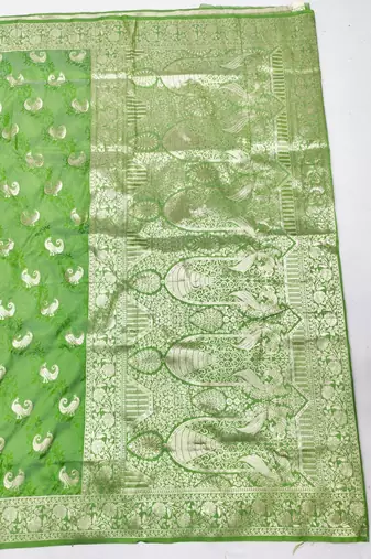 Light green zari woven silk blend saree with blouse piece