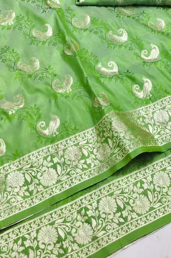 Light green zari woven silk blend saree with blouse piece