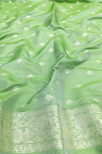 Light green zari woven silk blend saree with blouse piece