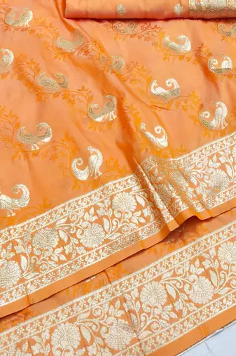 Orange zari woven silk blend saree with blouse piece