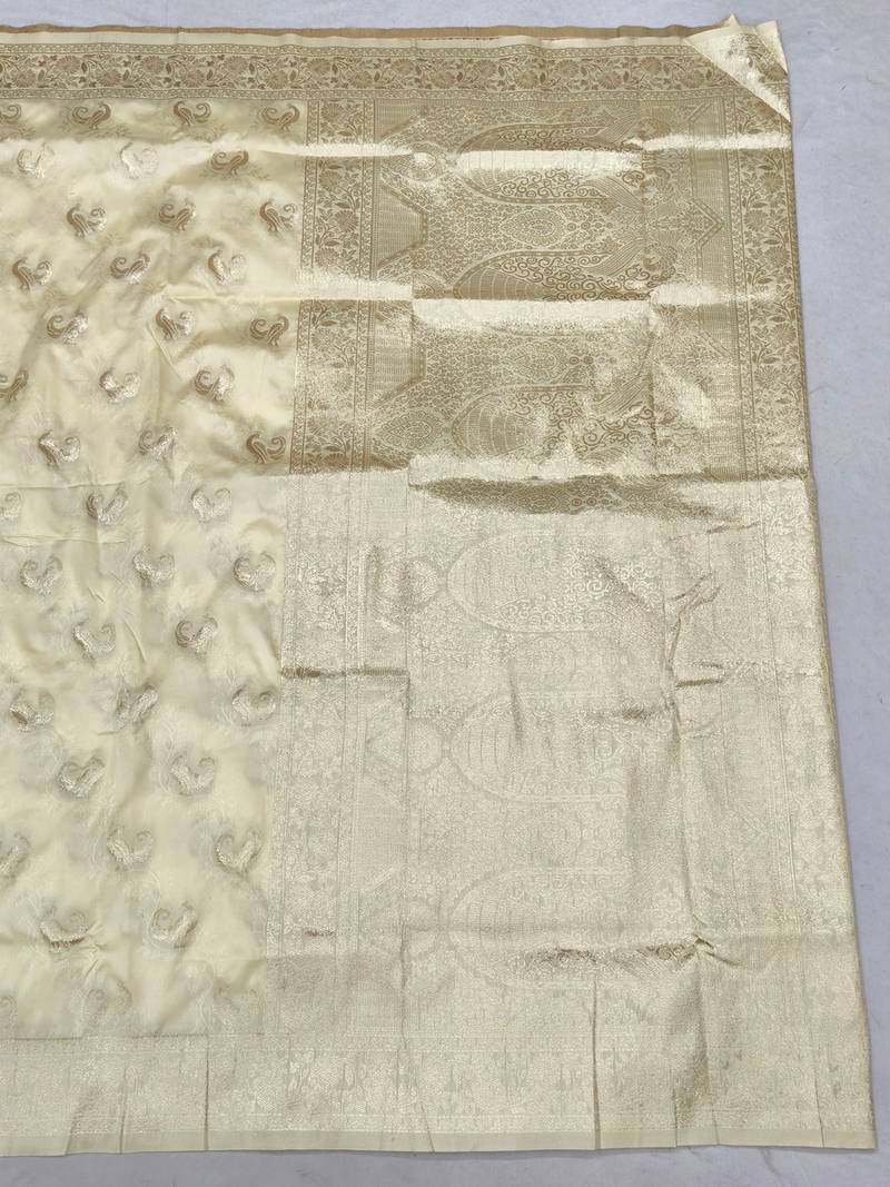 Cream zari woven banarasi silk blend saree with blouse piece