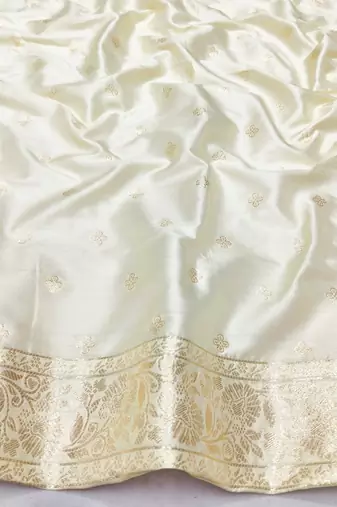 Cream zari woven silk blend saree with blouse piece