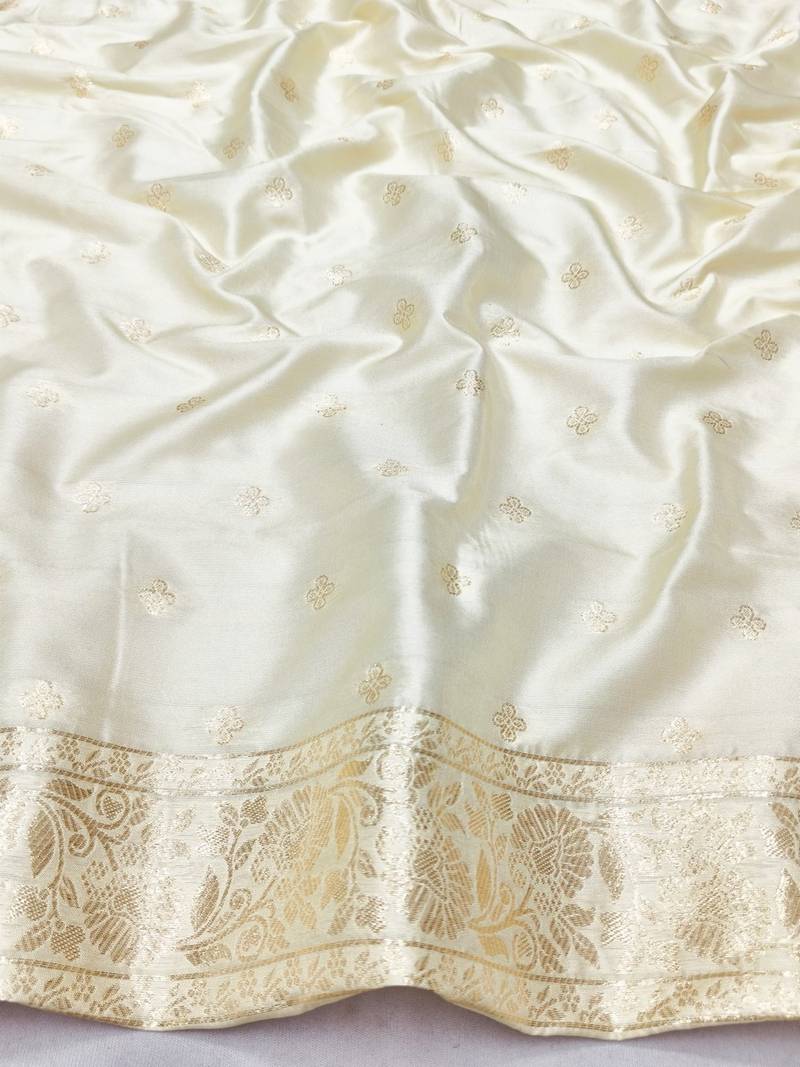 Cream zari woven banarasi silk blend saree with blouse piece