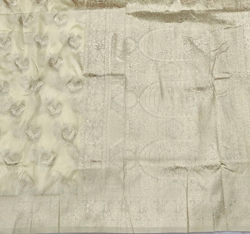 Cream zari woven banarasi silk blend saree with blouse piece