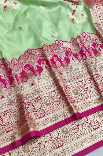 Light green zari woven silk blend saree with blouse piece