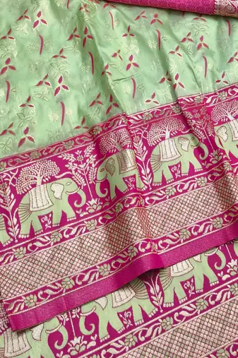 Light green zari woven silk blend saree with blouse piece