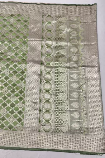 Light green zari woven silk blend saree with blouse piece