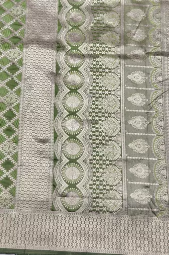 Light green zari woven silk blend saree with blouse piece
