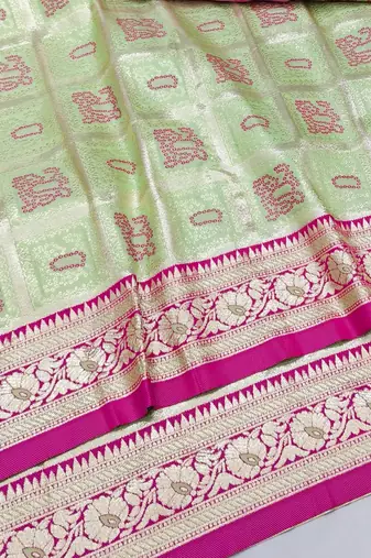 Light green zari woven silk blend saree with blouse piece