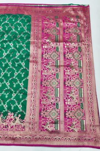 Green zari woven silk blend saree with blouse piece
