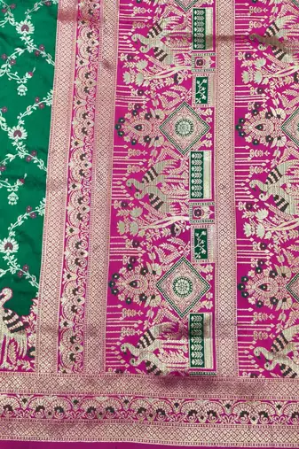 Green zari woven silk blend saree with blouse piece