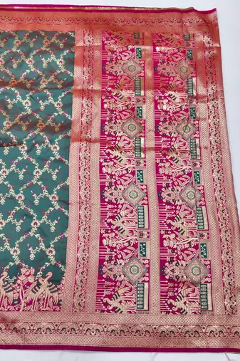 Tael green zari woven silk blend saree with blouse piece