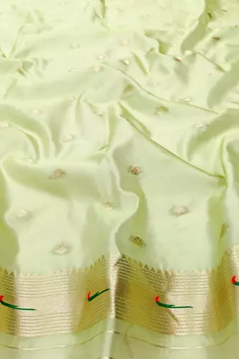 Light green zari woven paithani organza silk blend saree with blouse piece