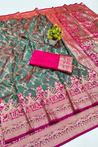 Sea green zari woven banarasi silk blend saree with blouse piece
