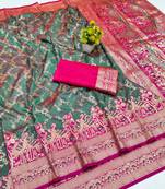 Sea green zari woven banarasi silk blend saree with blouse piece
