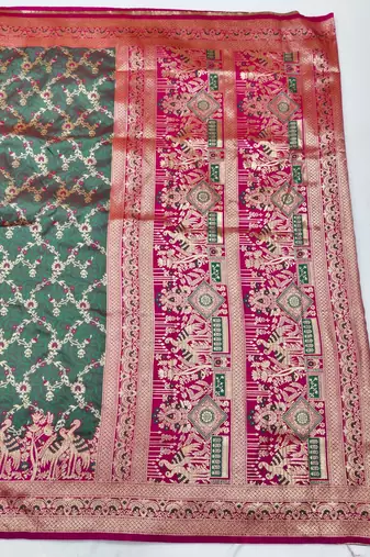 Sea green zari woven silk blend saree with blouse piece