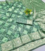 Sea green zari woven banarasi silk blend saree with blouse piece
