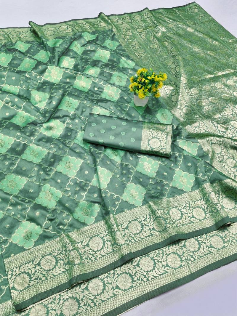 Sea green zari woven banarasi silk blend saree with blouse piece