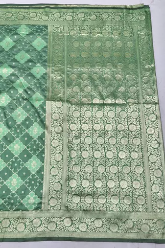 Sea green zari woven silk blend saree with blouse piece