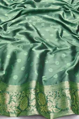 Sea green zari woven silk blend saree with blouse piece