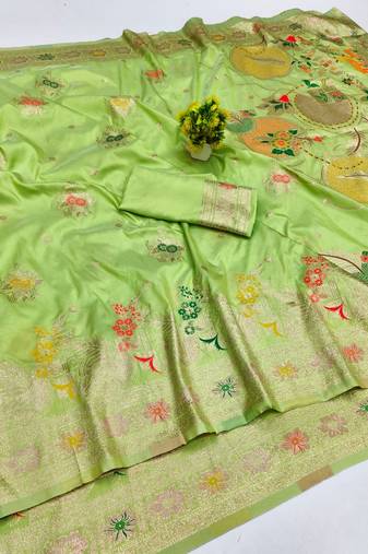 Light green zari woven banarasi silk blend saree with blouse piece